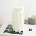 Nordic minimalist geometric plastic vase detail shot, elegant white tabletop home decor item. - Sharp Knife Vase White