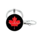 Detailed view of silver metal keychain with glass cabochon pendant featuring red maple leaf. - Maple Leaf City Skyline (1)