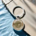 Fishing enthusiast metal keychain with glass cabochon pendant showcasing cool fish design. - Style 5