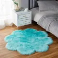 Plush fluffy flower-shaped area rug, soft turquoise faux wool bedroom floor mat detail. - Lake Blue