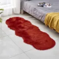 Red faux sheepskin plush area rug, soft fluffy bedside floor mat for bedroom or living room. - Red