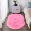 Pink oval fluffy plush rug, soft faux fur bedside carpet, anti-slip floor mat for bedroom. - Rose Pink Oval