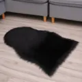 Black faux sheepskin fluffy rug, soft plush floor mat for bedroom and living room decor. - Black