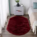 Dark red oval plush rug, soft fluffy bedside floor mat for bedroom, anti-slip design. - Burgundy Oval