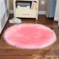 Pink fluffy round rug for bedroom, soft faux wool furry carpet for chair and bedside. - Long Plush Pink