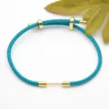 Turquoise gevlochten koord armband met gouden metalen kralen, stijlvol verstelbaar ontwerp - Teal
