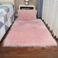 Pink faux wool plush area rug and matching cushion for bedroom bedside and living room decor. - Long Hair Light Pink