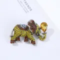 Close-up detail of vintage crystal rhinestone elephant brooch, alloy animal jewelry. - 5.1*3.9*1.8cm / Gold
