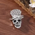 Vintage rhinestone skull brooch with top hat, detailed alloy crystal lapel pin for daily wear. - Leaning Top Hat Skull (Antique Silver)