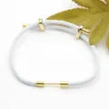 White braided rope bracelet with gold metal accent, adjustable DIY couple jewelry accessory. - White