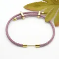 Purple braided rope bracelet with gold metal sliding beads and adjustable design for couples. - Purple