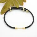 Black braided leather bracelet with gold metal accessories, stylish design for couples daily wear. - Black