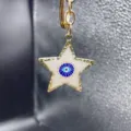 Gold alloy star keychain featuring a classic blue evil eye enamel design for stylish bag charms. - Style L