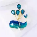 Detailed shot of cute blue whale brooch featuring sparkling crystal balloon elements. - 1 Piece / Blue