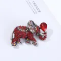 Detailed closeup of the luxury rhinestone elephant brooch featuring vibrant red crystal details. - 5.1*3.9*1.8cm / Red