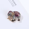 Close-up detail of a vintage style elephant brooch featuring rhinestone and enamel craft. - 2.7*3.32cm / Silver