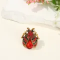 Close-up detail of vintage beetle brooch, alloy metal with red and black rhinestones. - 2.2*2.6cm / Gold Base Red