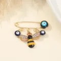 Evil eye bee safety pin brooch with sparkling rhinestones and blue beads, elegant accessory. - Rhinestone Bee Style (4)