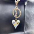 Alloy heart keychain with colorful enamel eye and flower design for bags and cars. - Style P