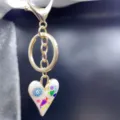Alloy heart keychain bag charm with colorful doodle enamel pendant detail view for women. - Style M
