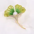 Close-up detail of a delicate ginkgo leaf enamel brooch with pearl and sparkling rhinestones. - 5.6*4.3cm / Green