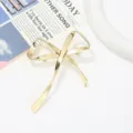 Élégante broche nœud en métal doré pour femme, accessoire de mode minimaliste pour vêtements. - 7x10.5x1cm / Or KC Clair