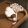 Exquisite ginkgo leaf brooch with pink crystals, white enamel, and pearl for elegant suits. - 12.00g / 4.5*5.2CM / Gold