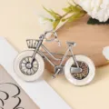 Close-up of vintage alloy bicycle brooch with imitation shell wheels and sparkling crystal accent. - Silver White Faux White Shell Style (A-4-14)