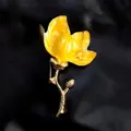 Detailed view of a golden magnolia flower brooch with bright yellow enamel petals. - Yellow Magnolia (XZ674) / 7.8x4.7x1.5cm / Vintage Yellow
