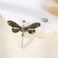 Close-up of the vintage dragonfly rhinestone brooch with green enamel wings and magnetic back. - Dragonfly Style / 14