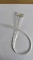 Synthetic white clip-in hair extension piece, perfect for easy daily highlights styling. - White