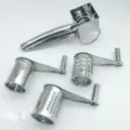 Stainless steel rotary cheese grater detail showing interchangeable drums and main handle body. - Triple Drum Set / Plastic Bag Packaging