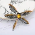 Exquisite dragonfly brooch with sparkling yellow rhinestones and hollow metallic wings design. - Silver Yellow Rhinestone Large Main Stone Dragonfly Style (0401-03)