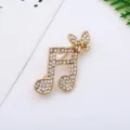 Detailed view of gold rhinestone musical note butterfly brooch, sparkling crystal jewelry. - Music Note Butterfly (18#)