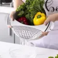Passoire demi-lune en acier inoxydable et égouttoir à légumes outil de cuisine pratique. - Par défaut