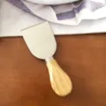 Stainless steel cheese knife with natural wooden handle, single piece variant display. - Spatula (Wooden Handle)