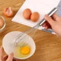 Edelstahl Schneebesen manueller Eierquirl Kueche Backen Werkzeug fuer den taeglichen Gebrauch - 10 Zoll