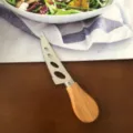 Stainless steel cheese knife with wooden handle, perfect for cutting cheese, butter and soft pastries. - Wooden Handle Serrated Knife