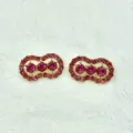 Detailed close-up of shiny pink rhinestone peanut shaped brooch pin for stylish daily wear. - Crimson Red