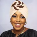 Detailed view of bohemian style patchwork turban hat, stylish and comfortable headwear for women. - One Size / Beige