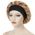 Gold satin sleep bonnet with black wide elastic band variant for hair care and sleeping. - One Size / Gold