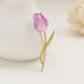Close-up detail of a charming purple tulip brooch with green leaf and gold stem for women. - Pink Purple