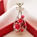 Detail view of Chinese style pipa brooch with rhinestones and pink flowers for suits. - Pink Flower Red Agate Pipa