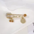 Exquisite gold safety pin brooch detail, vintage rhinestone religious style jewelry piece. - Gold Yellow Series