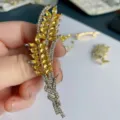Close-up detail of elegant wheat ear brooch with sparkling crystal rhinestones for women. - Twist Wheat