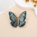 Broche papillon elegante avec zircon scintillant et resine bleue pour vetements de femmes. - Papillon iridescent / 4,2 cm x 4,0 cm