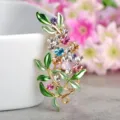 Exquisite colorful floral brooch detail close-up showcasing sparkling rhinestones and leaves. - Multicolor