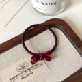 Grazioso elastico per capelli con fiocco rosso scuro accessorio elegante per donna. - Elastico Fiocco Rosso