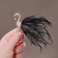 Exquisite flamingo brooch featuring black feather tail and sparkling crystal accents for women. - Black