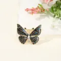 Elegant butterfly brooch with sparkling rhinestones and black enamel details for women clothing. - Butterfly / 3.2x3.8cm